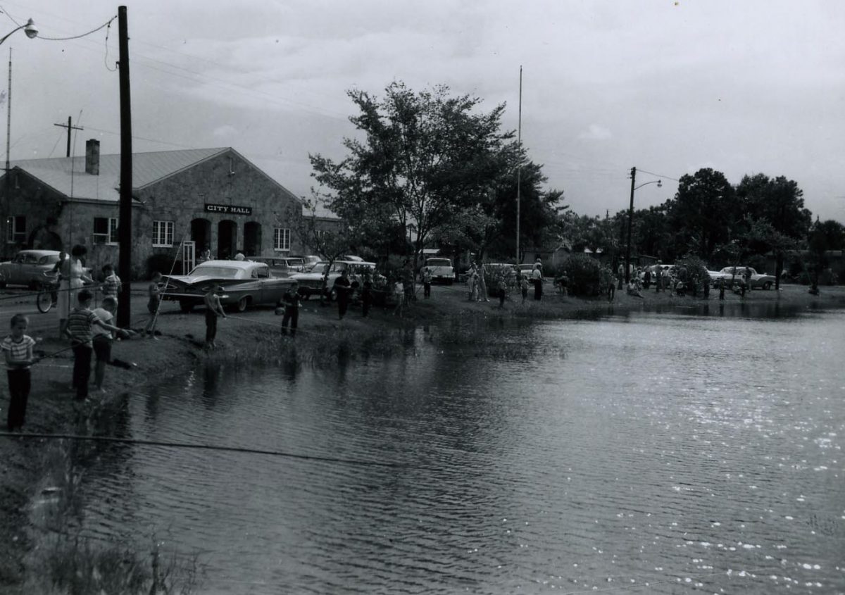 Fishing on Lake Lucille, 1959, in front of the Bunnell City Hall