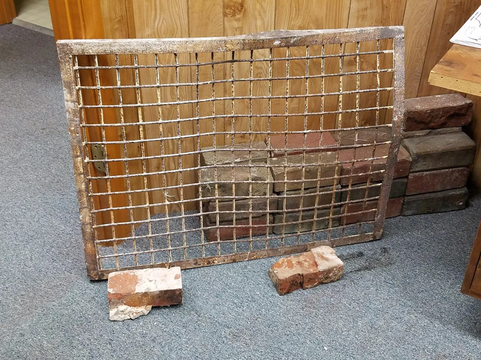 Figure 14 - Salvaged Jailhouse Barred Window Frame and 2 Bricks from the WPA-Built Flagler County Jail Demolition – on Display at the Holden House Annex building - Photo taken by Randy Jaye on July 2, 2019.