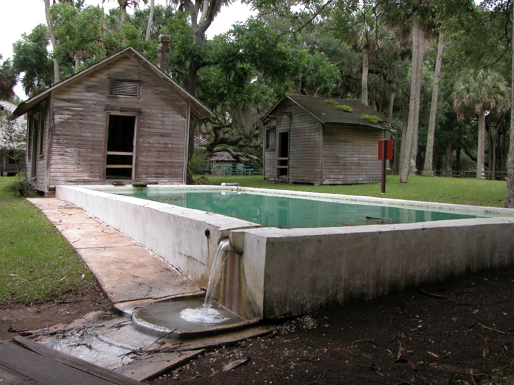 First swimming pool in Florida made of poured concrete.  Image by Bill Ryan shows original bath houses later replaced by replicas.
